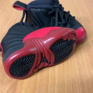 Sleek Black and Red Athletic Sneakers with Geometric Outsole size 3c $45